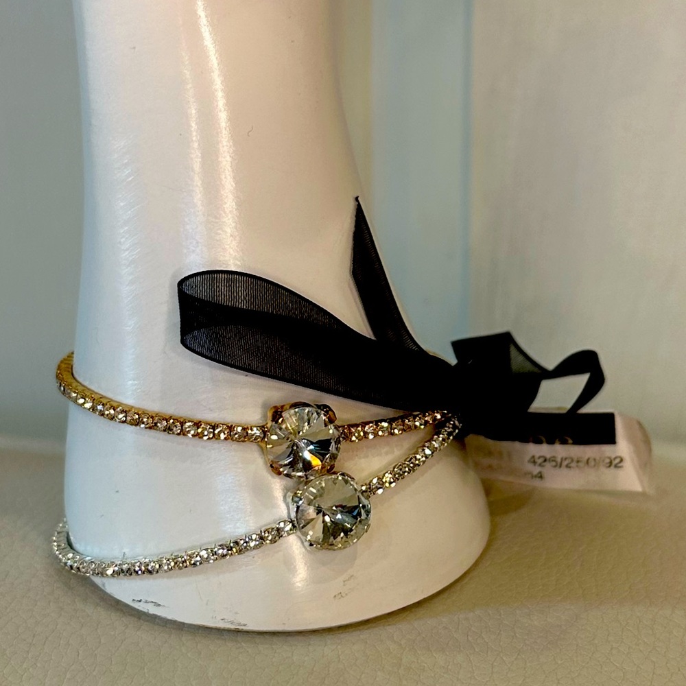 Two gold and silver bracelets with large stone